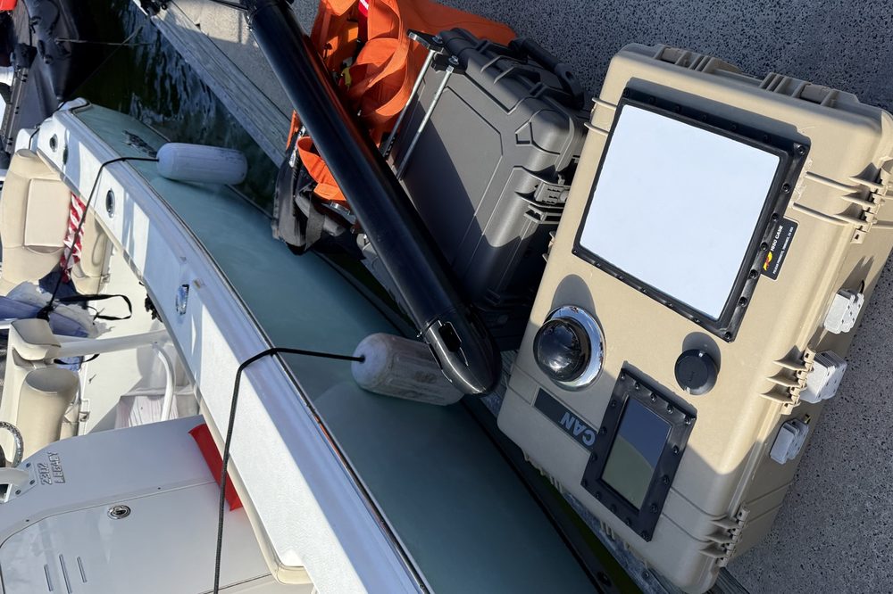 DIB case and towed sensor body staged on a dock